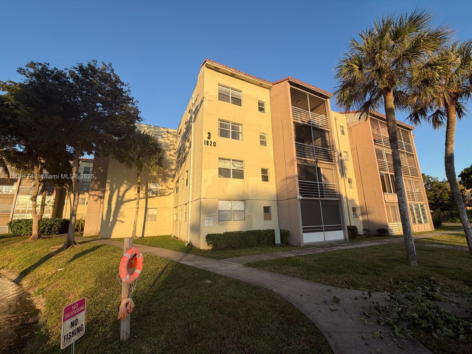 1820 Southwest 81st Avenue, Unit 3107 North Lauderdale, FL 33068 - Photo 21 of 25 a front view of a house with a yard