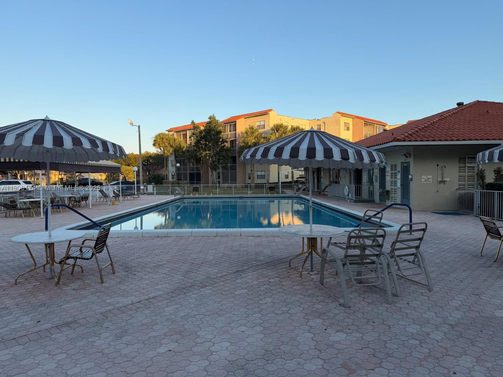 1820 Southwest 81st Avenue, Unit 3107 North Lauderdale, FL 33068 - Photo 25 of 25 a view of a chairs and table in patio