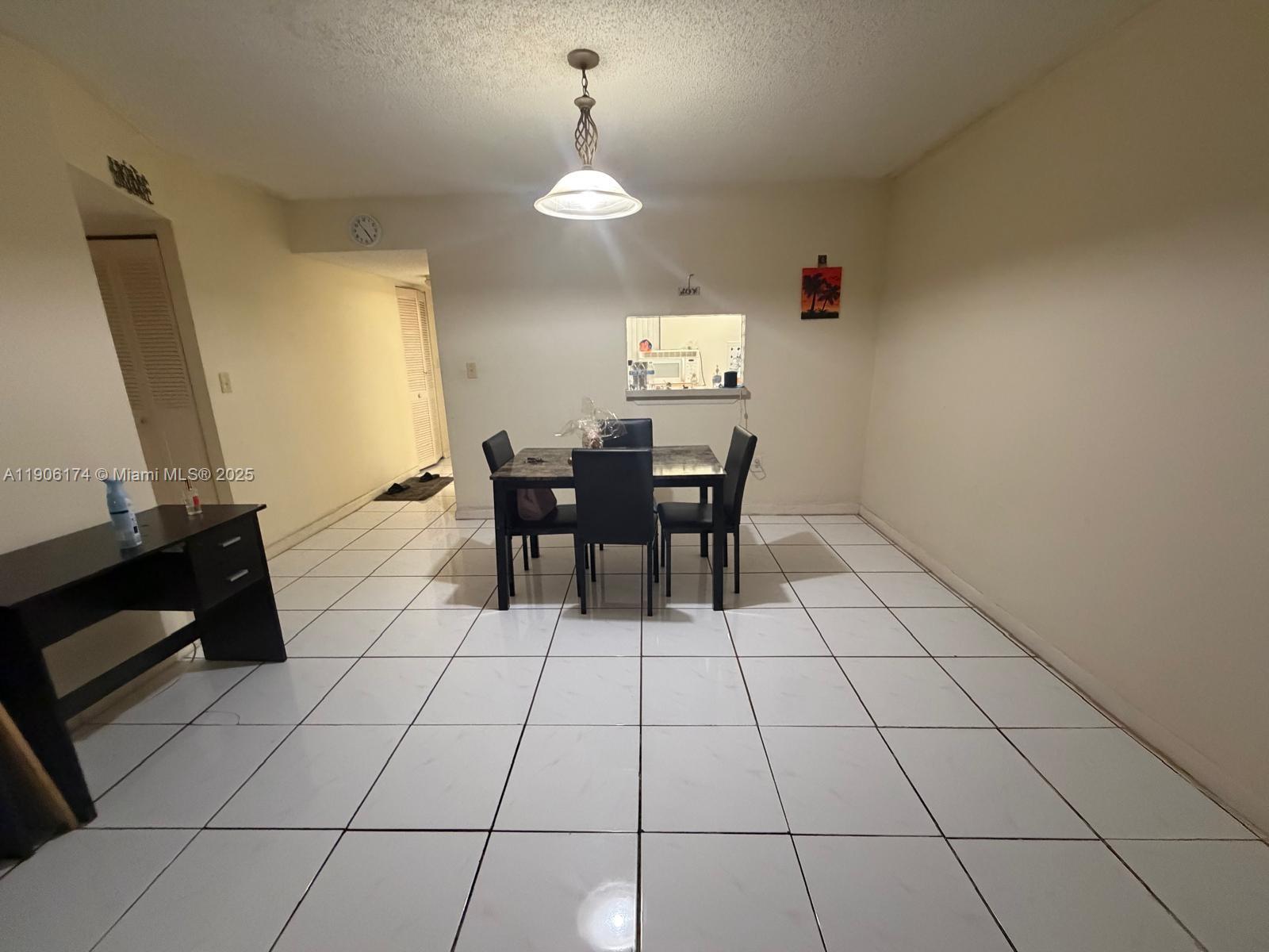 1820 Southwest 81st Avenue, Unit 3107 North Lauderdale, FL 33068 - Photo 5 of 25 a view of a dining room with furniture