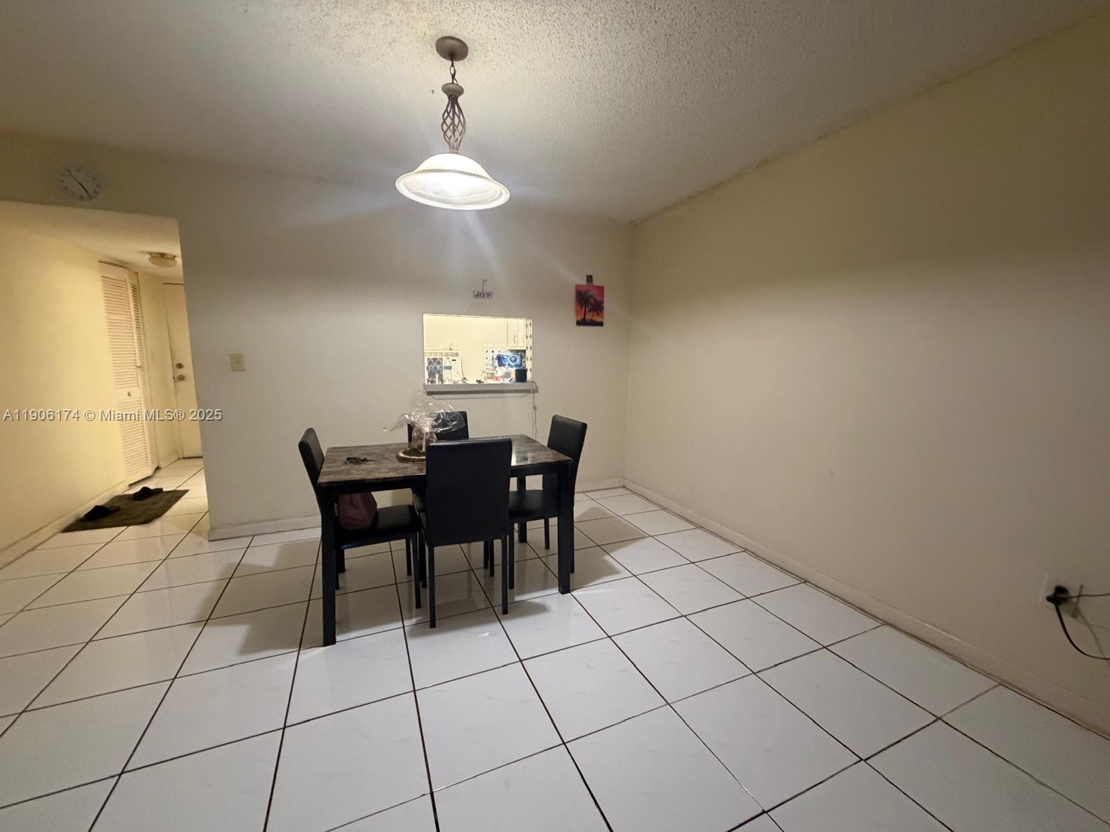 1820 Southwest 81st Avenue, Unit 3107 North Lauderdale, FL 33068 - Photo 7 of 25 a view of a dining room with furniture