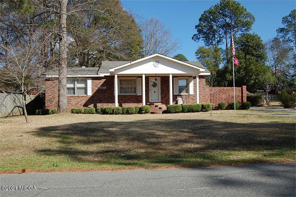 648 Pine Ridge Street Perry, GA 31069 - Photo 1 of 1 a front view of a house with a yard