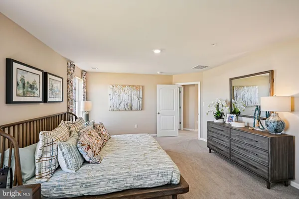 a bedroom with bed and window