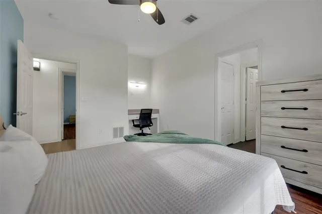 a bedroom with a bed and furniture