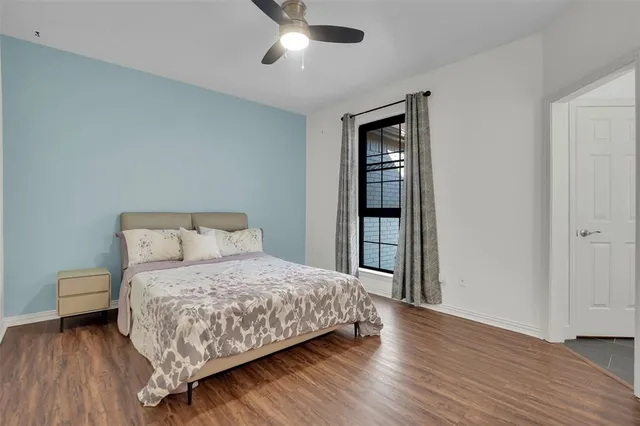 a bedroom with a bed and a table