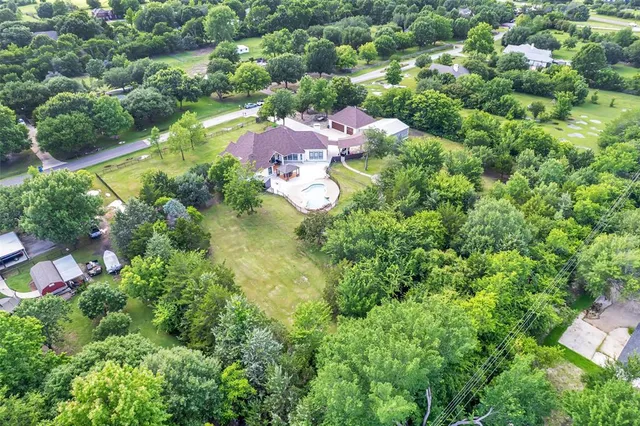 an aerial view of house with yard