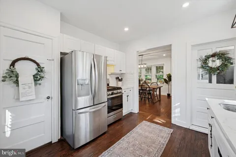a kitchen with stainless steel appliances a refrigerator and microwave