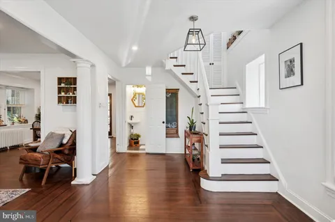a view of entryway with livingroom and wooden floor