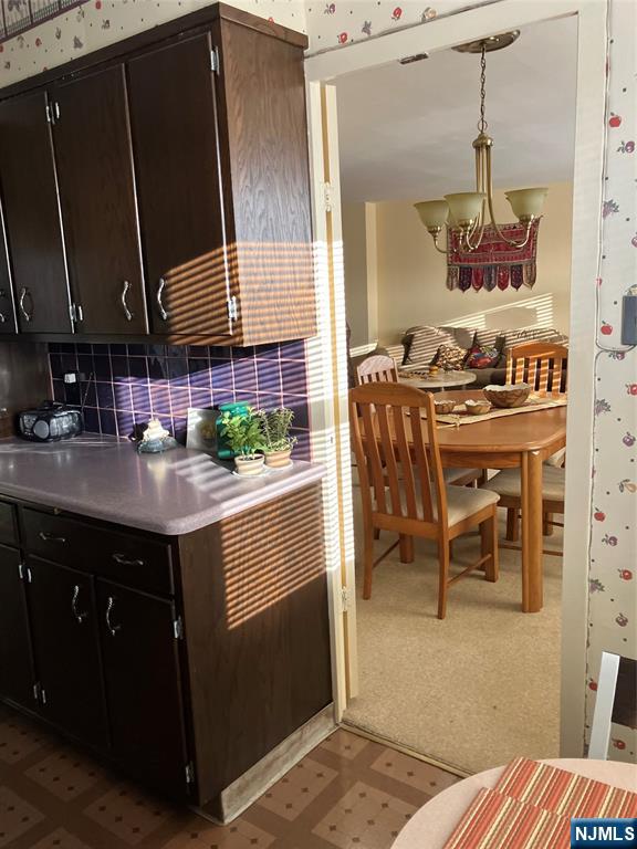 280 Prospect Avenue, Unit 11H Hackensack, NJ 07601 - Photo 10 of 20 a kitchen with a sink stove and cabinets
