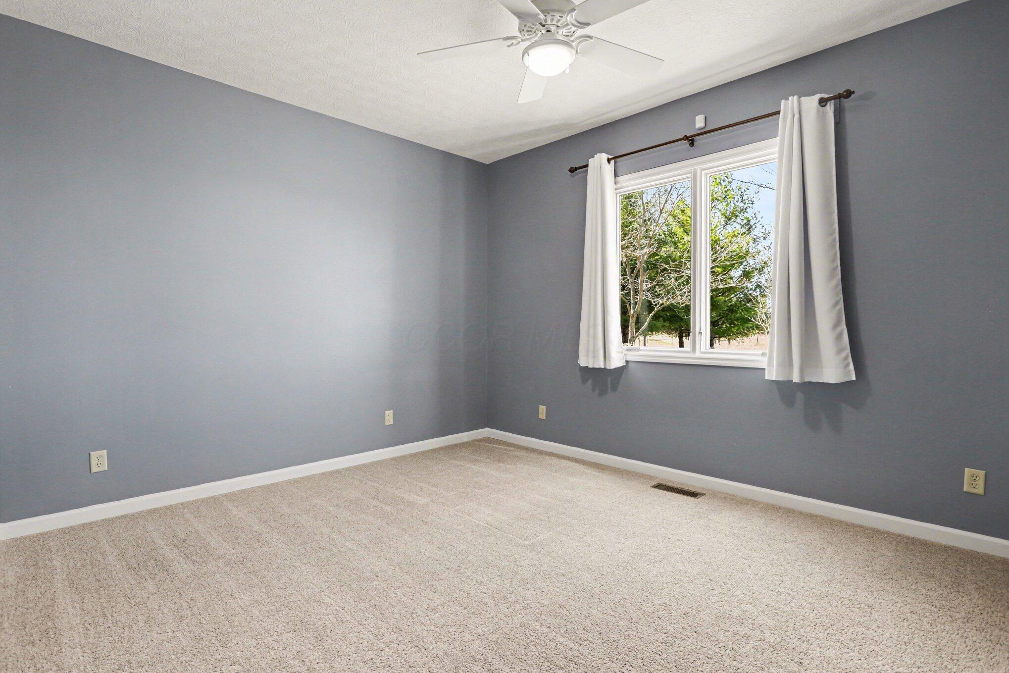 1855 Spring Valley Road London, OH 43140 - Photo 22 of 54 Spacious with good natural light, ceiling fan.