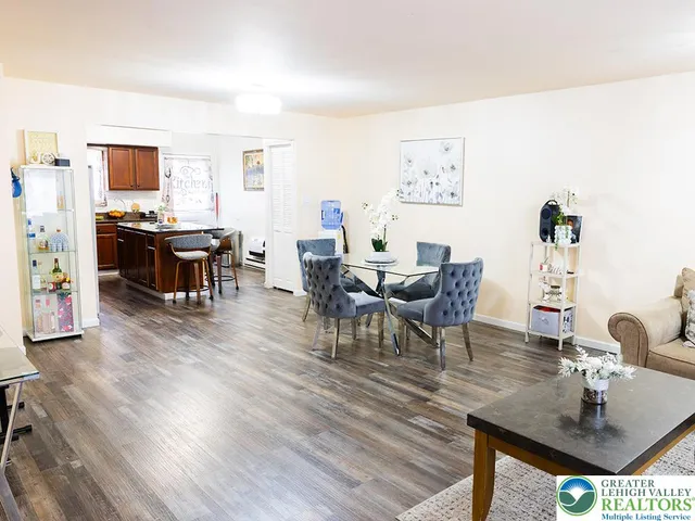 a view of a dining room with furniture and wooden floor