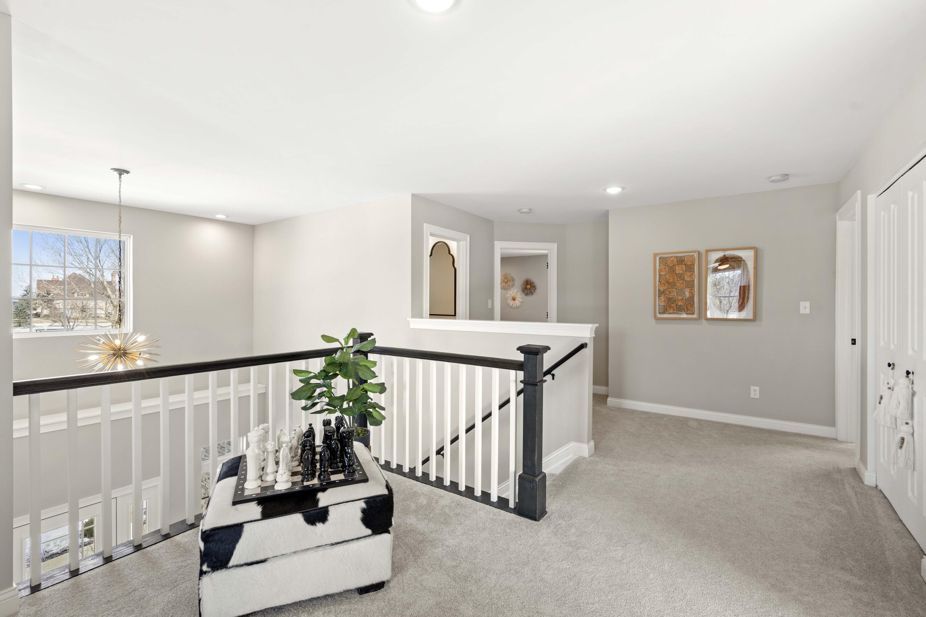 10534 California Street Crown Point, IN 46307 - Photo 12 of 23 a living room with furniture and flowers
