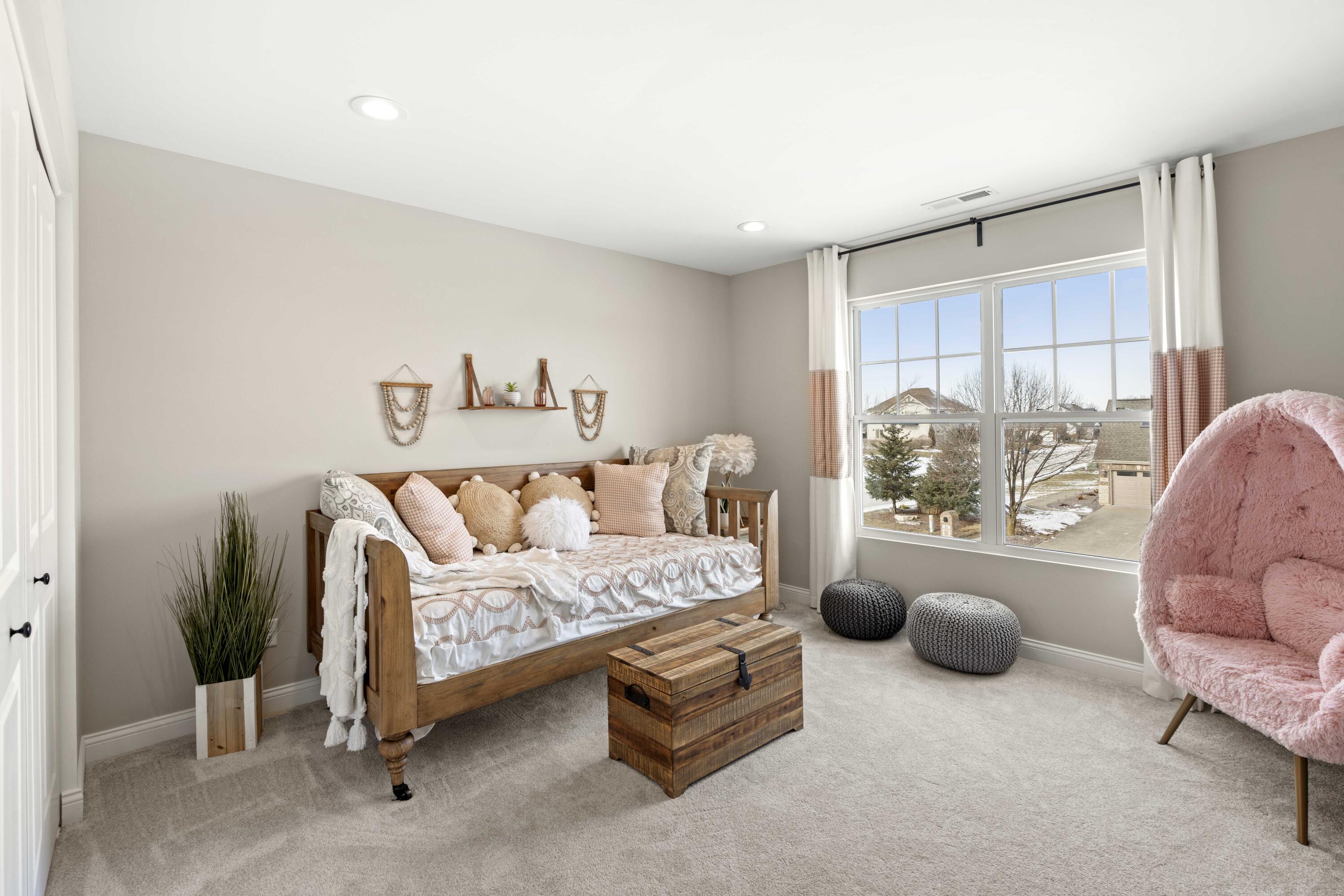 10534 California Street Crown Point, IN 46307 - Photo 15 of 23 a bedroom with furniture and a chandelier