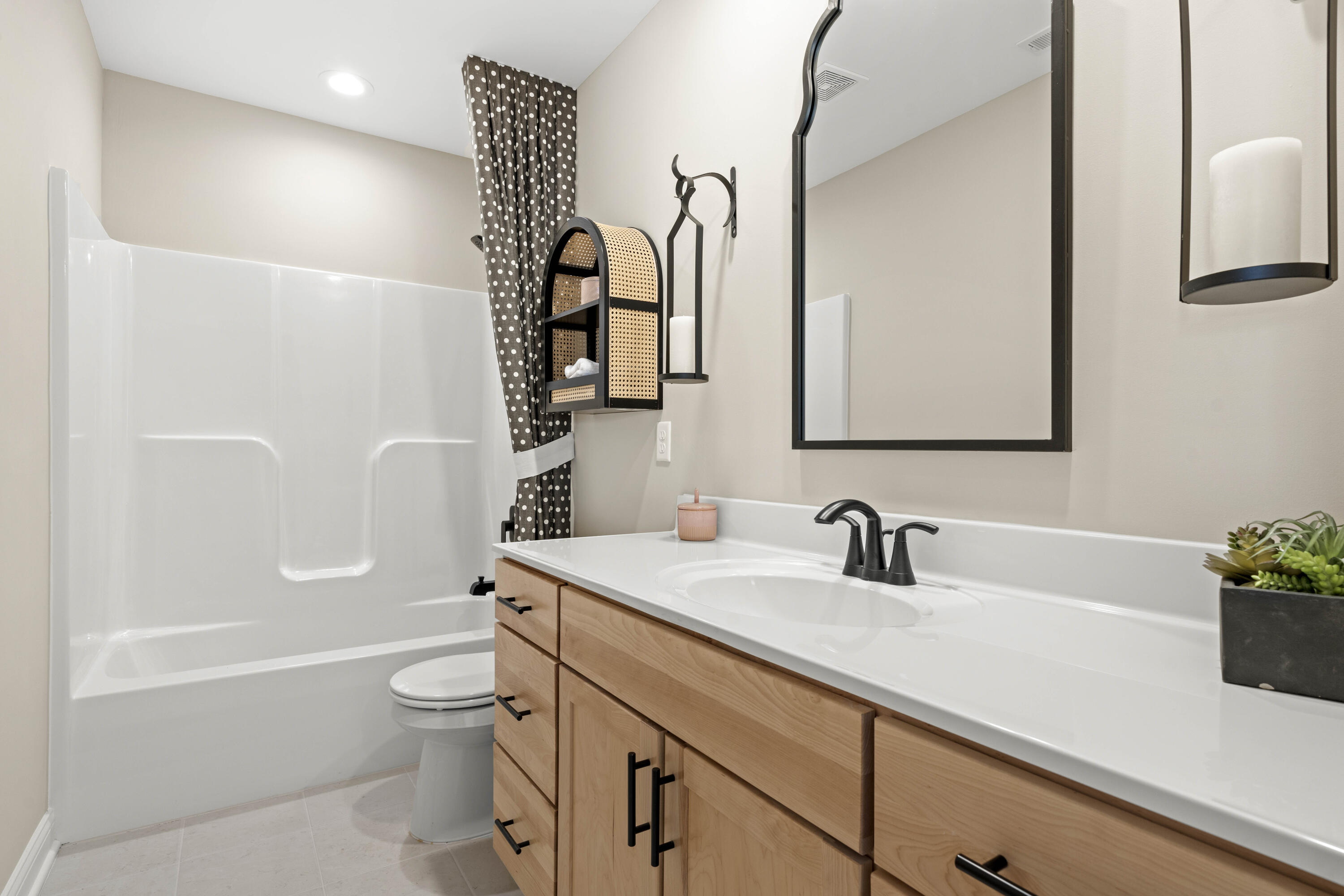 10534 California Street Crown Point, IN 46307 - Photo 17 of 23 a bathroom with a sink a toilet and shower