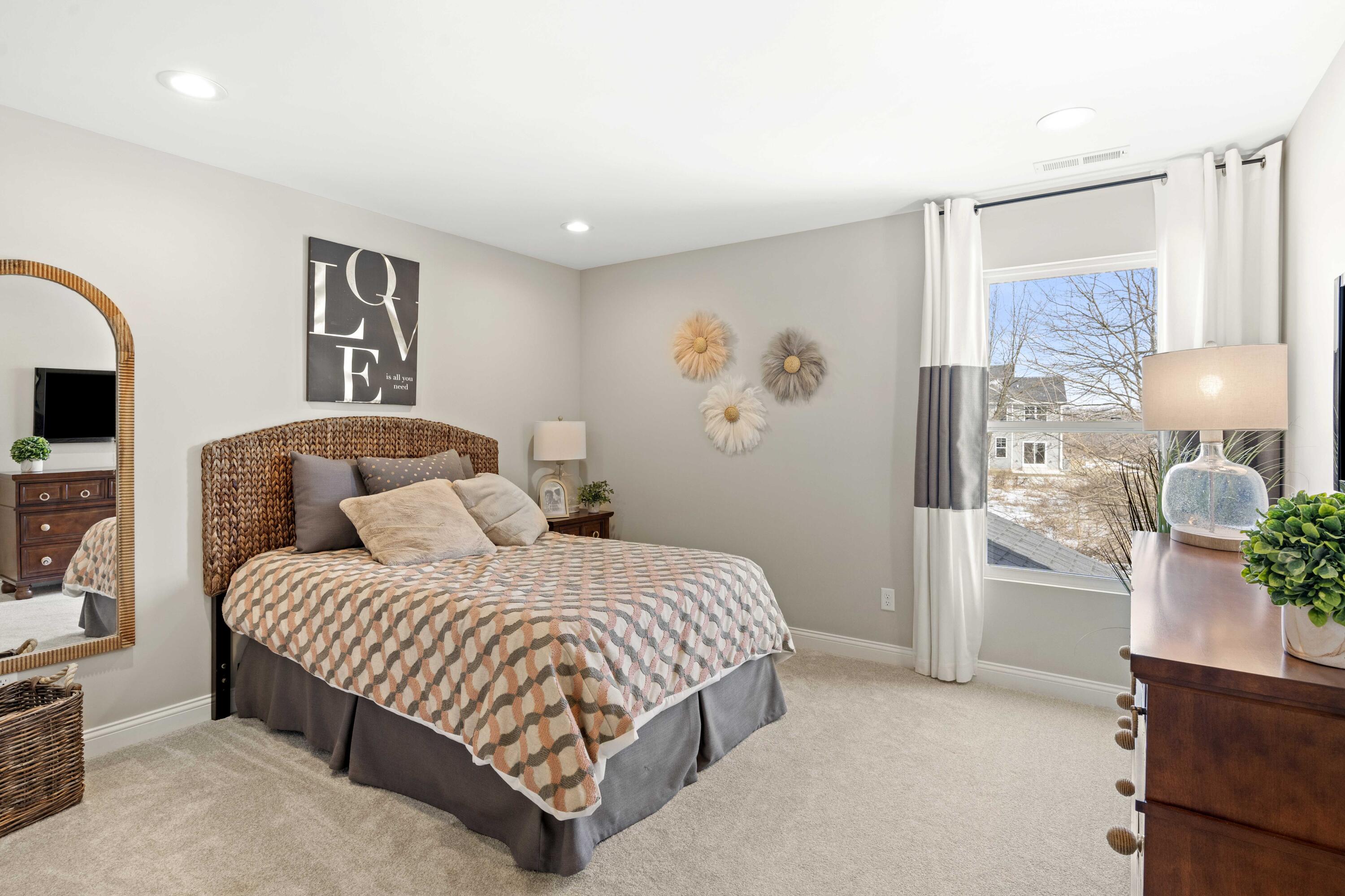 10534 California Street Crown Point, IN 46307 - Photo 18 of 23 a bedroom with a large bed and a painting on the wall