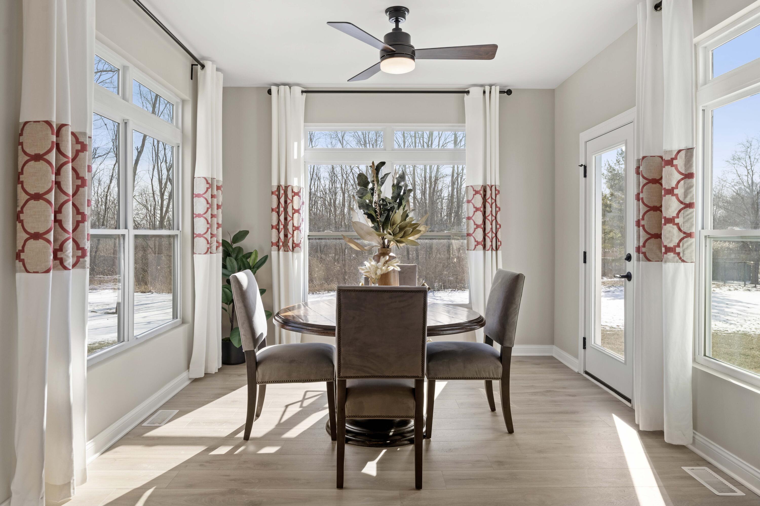 10534 California Street Crown Point, IN 46307 - Photo 10 of 23 a view of a dining room with furniture window and wooden floor