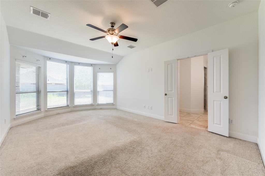 7025 Trailhead Street Little Elm, TX 76227 - Photo 14 of 25 a view of an empty room with a window