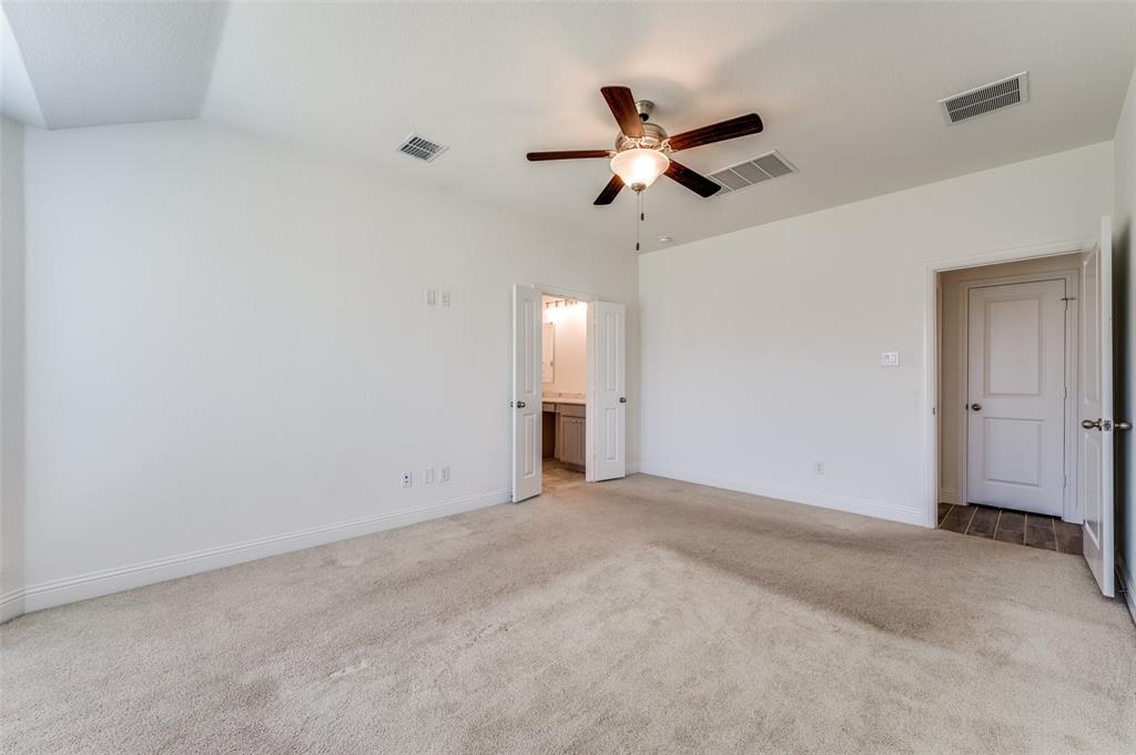 7025 Trailhead Street Little Elm, TX 76227 - Photo 15 of 25 a view of an empty room with a chandelier fan