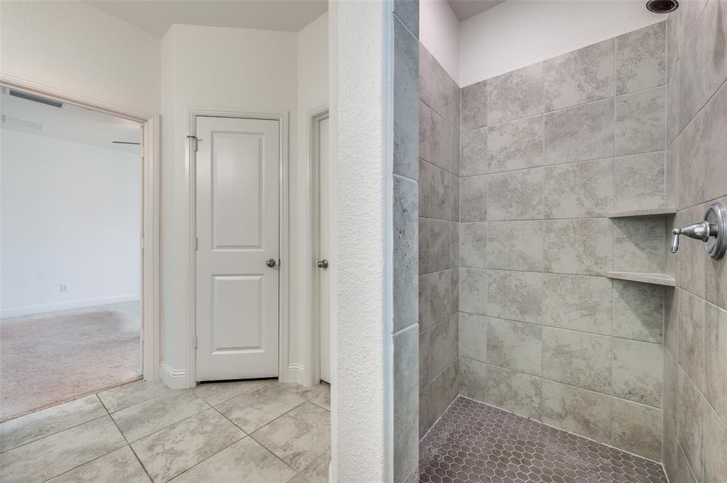 7025 Trailhead Street Little Elm, TX 76227 - Photo 18 of 25 a bathroom with a shower