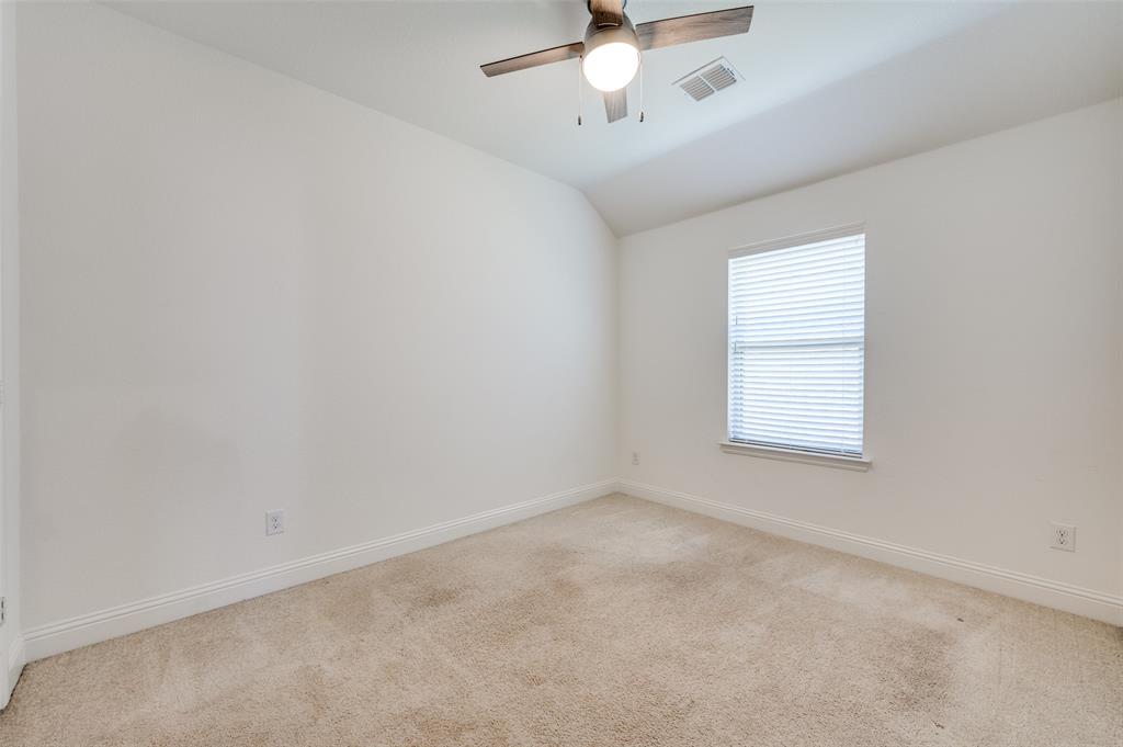 7025 Trailhead Street Little Elm, TX 76227 - Photo 22 of 25 an empty room with a window