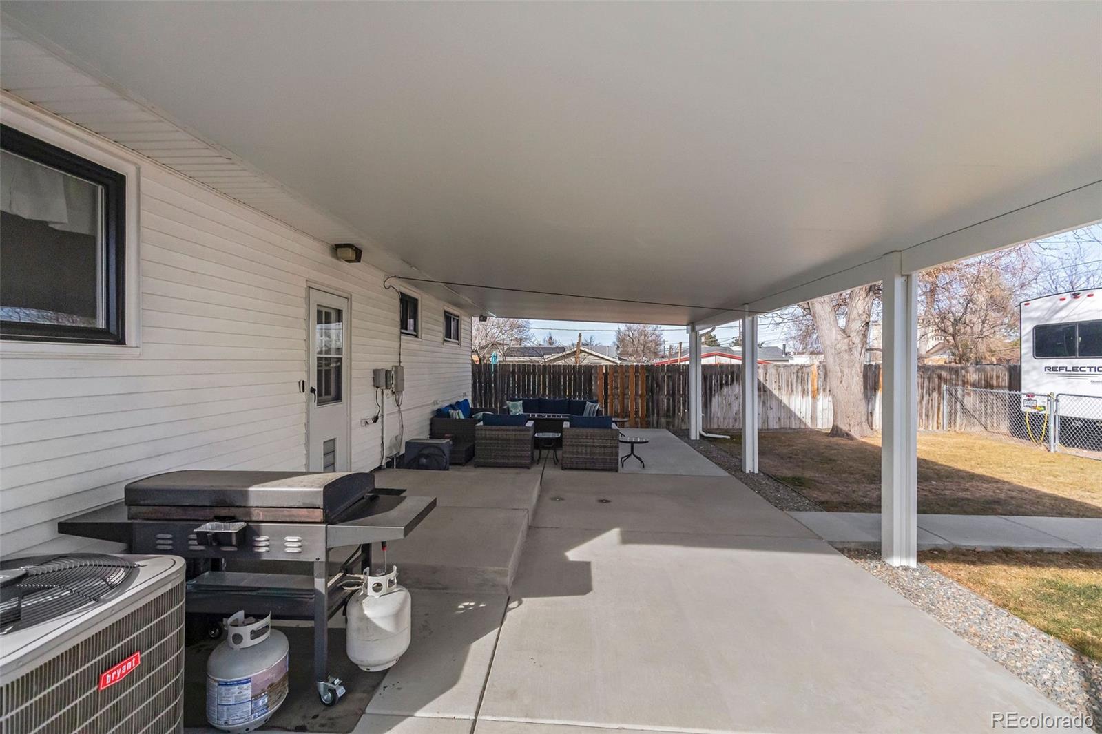 648 South 3rd Avenue Brighton, CO 80601 - Photo 19 of 26 a view of a livingroom with furniture and a window