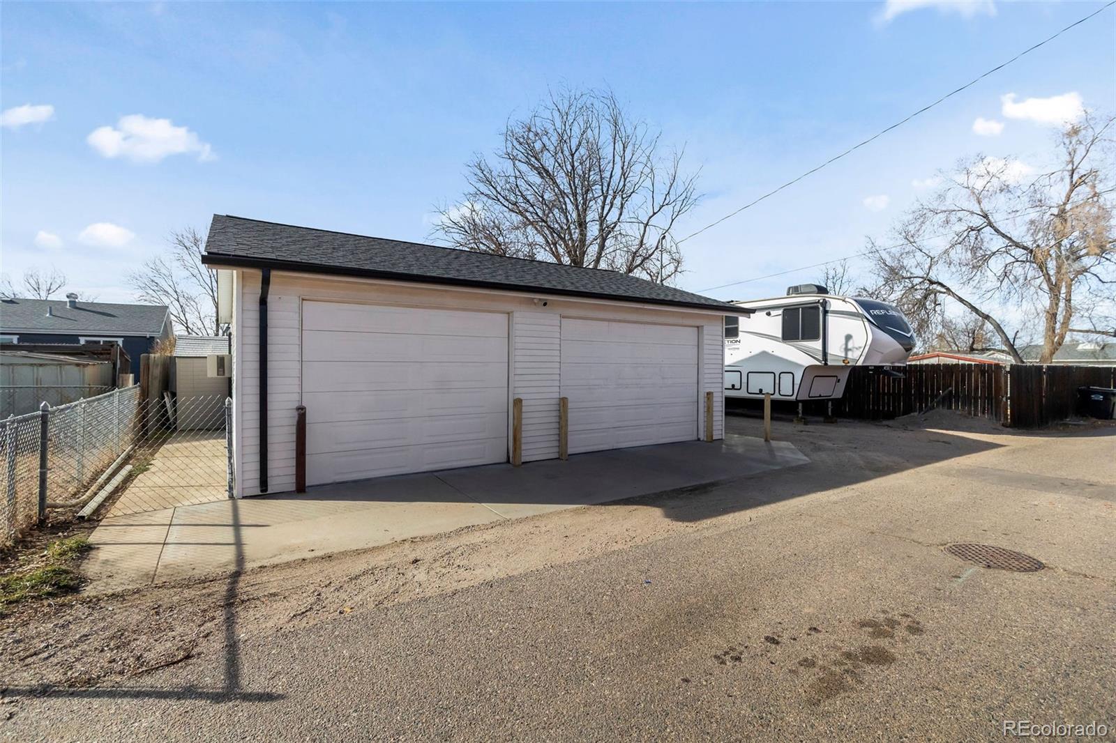 648 South 3rd Avenue Brighton, CO 80601 - Photo 22 of 26 a front view of a house with a yard