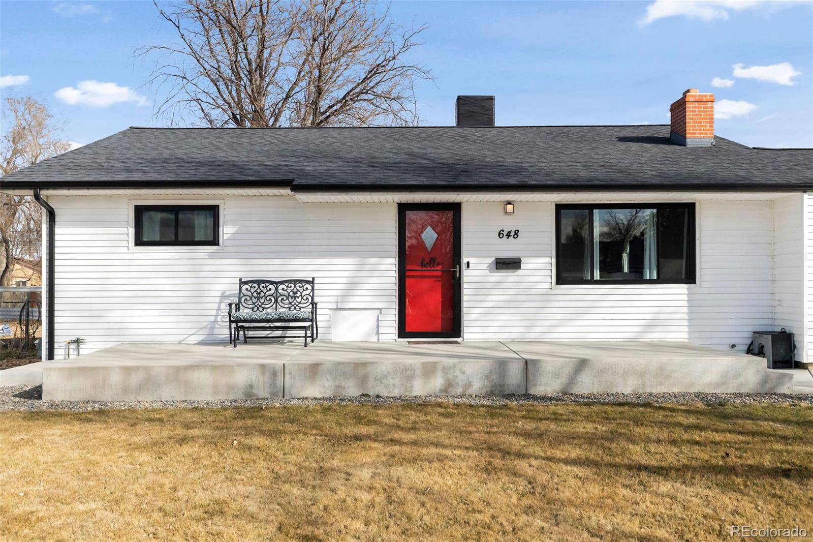 648 South 3rd Avenue Brighton, CO 80601 - Photo 25 of 26 a front view of a house with a yard