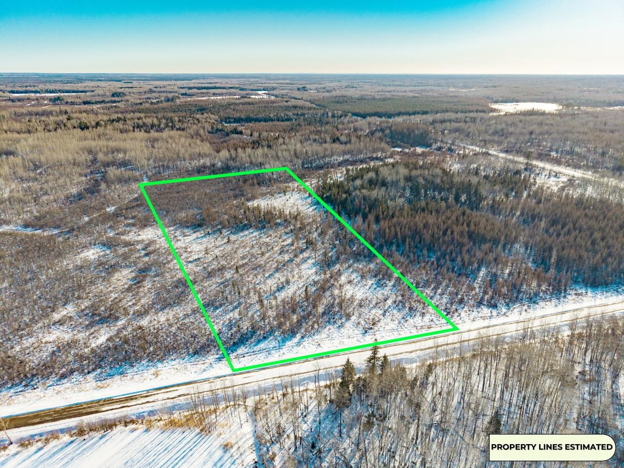 View of property location with property boundaries highlighted and a heavily wooded area