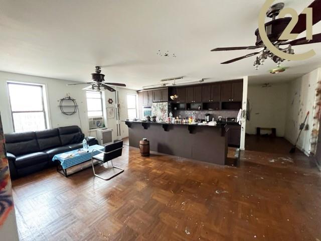 2425 Kings Highway, Unit 8E Brooklyn, NY 11210 - Photo 5 of 9 a living room with furniture and kitchen view