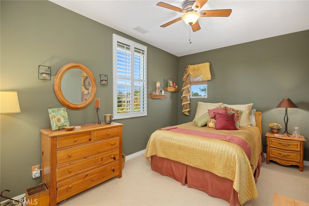 1549 Via Rojas Templeton, CA 93465 - Photo 13 of 29 a bedroom with a bed and a chandelier