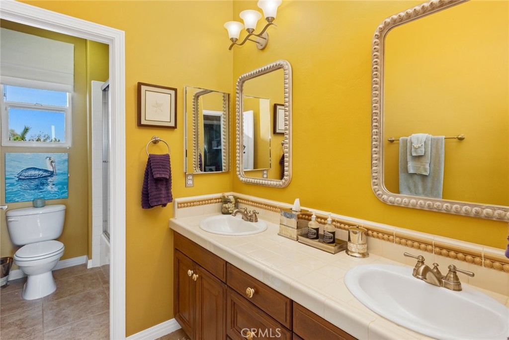 1549 Via Rojas Templeton, CA 93465 - Photo 14 of 29 a bathroom with a granite countertop sink and a mirror