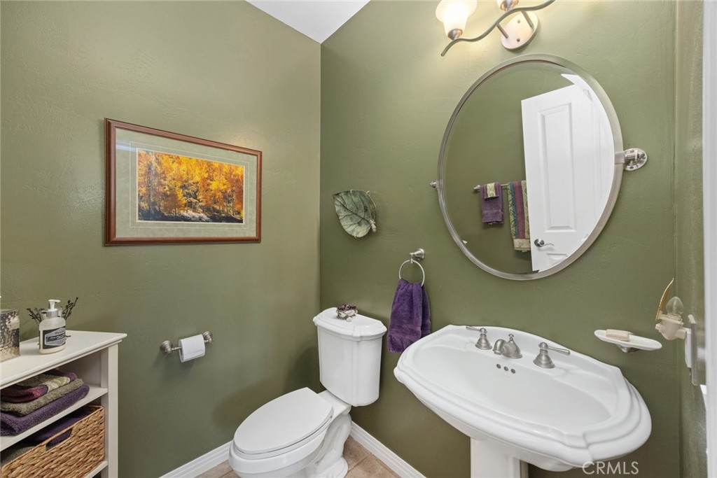 1549 Via Rojas Templeton, CA 93465 - Photo 16 of 29 a bathroom with a toilet a sink and mirror