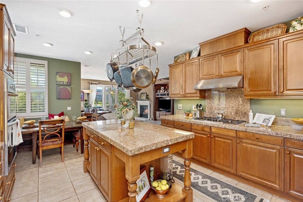 1549 Via Rojas Templeton, CA 93465 - Photo 17 of 29 a kitchen with granite countertop a sink a stove and cabinets