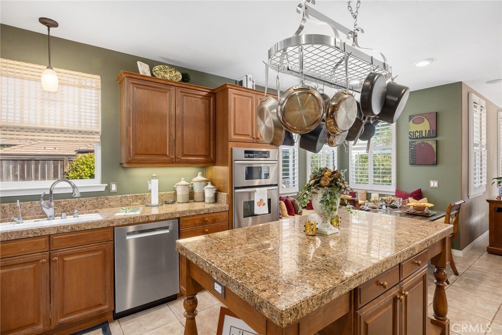 1549 Via Rojas Templeton, CA 93465 - Photo 19 of 29 a kitchen with granite countertop a sink a stove and cabinets