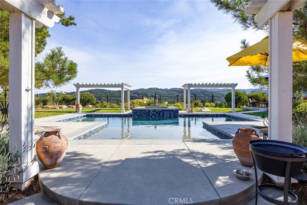 1549 Via Rojas Templeton, CA 93465 - Photo 2 of 29 a view of a swimming pool with a lounge chairs