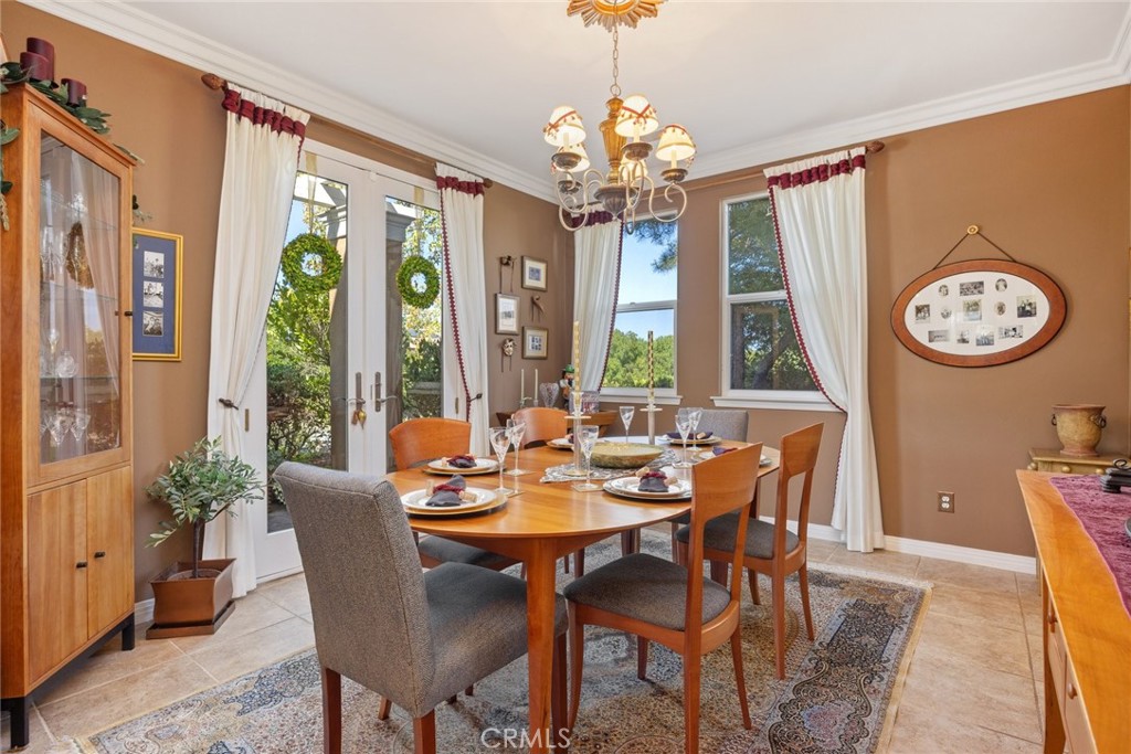 1549 Via Rojas Templeton, CA 93465 - Photo 9 of 29 a view of a dining room with furniture a chandelier and large windows