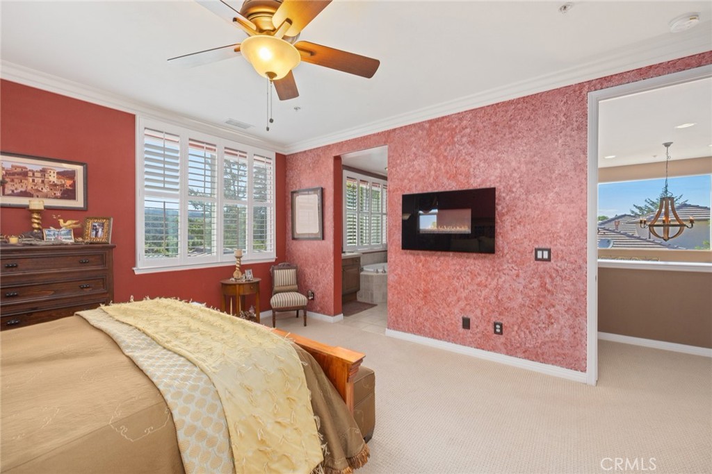 1549 Via Rojas Templeton, CA 93465 - Photo 10 of 29 a bedroom with a bed and a chandelier