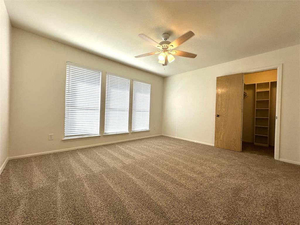 724 Cory Street Grapevine, TX 76051 - Photo 8 of 16 a view of an empty room with a window