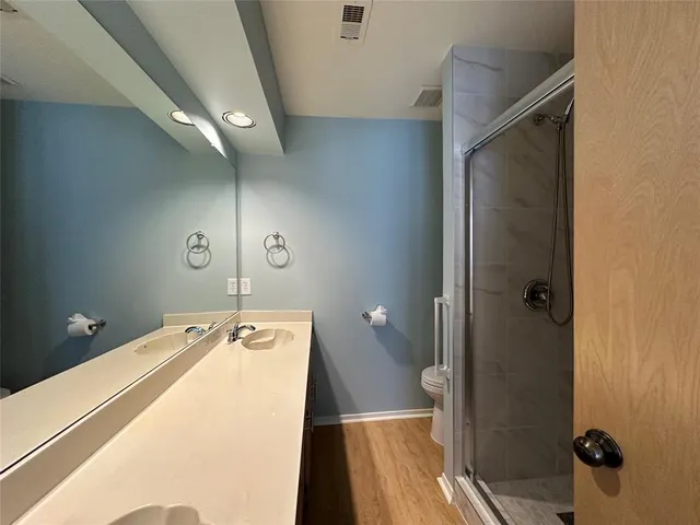 a bathroom with a sink and shower