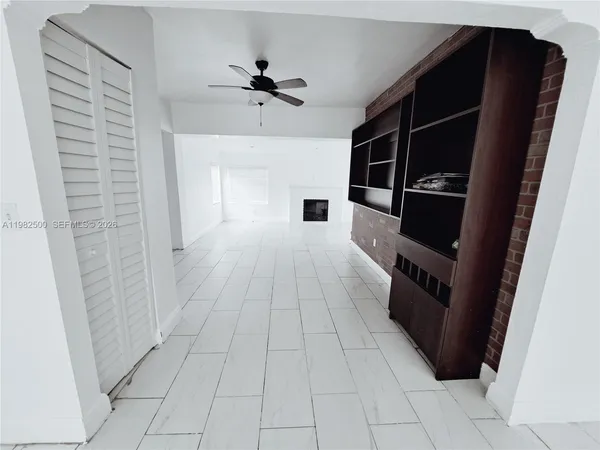 a hallway view with hardwood floor