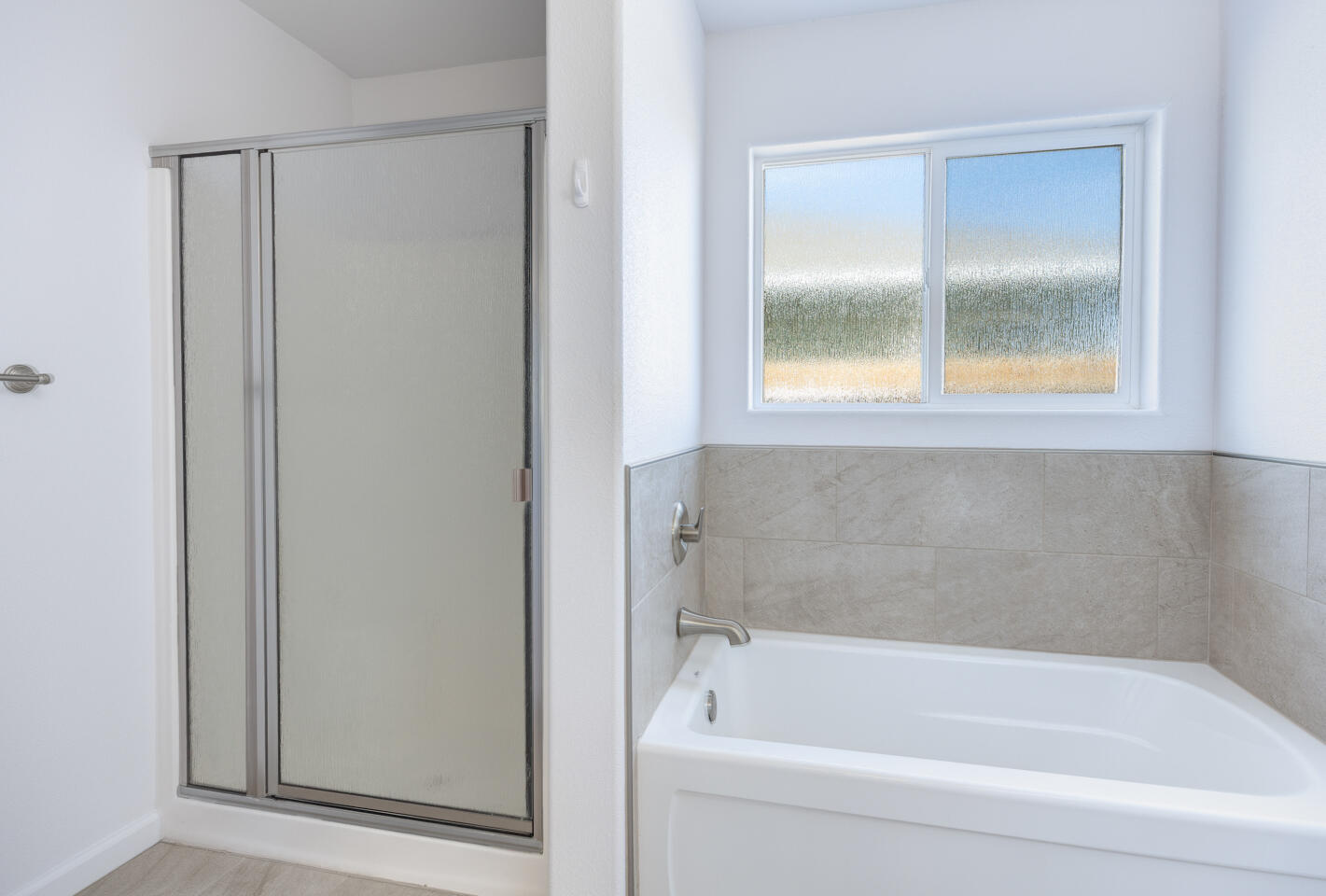 772 Megan Way Fallon, NV 89406 - Photo 14 of 22 a white bath tub sitting next to a window