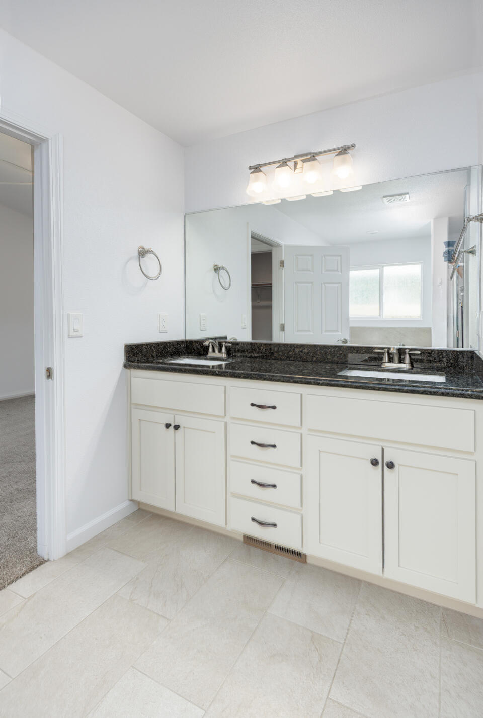 772 Megan Way Fallon, NV 89406 - Photo 15 of 22 a kitchen with granite countertop white cabinets and a sink