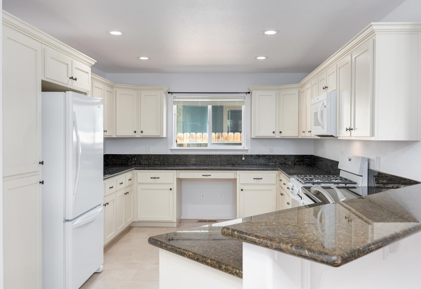 772 Megan Way Fallon, NV 89406 - Photo 5 of 22 a kitchen with stainless steel appliances granite countertop a sink stove and refrigerator