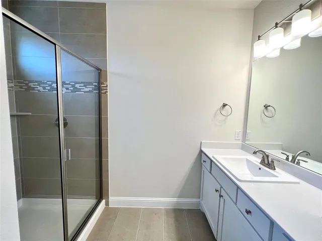 a bathroom with a sink and mirror
