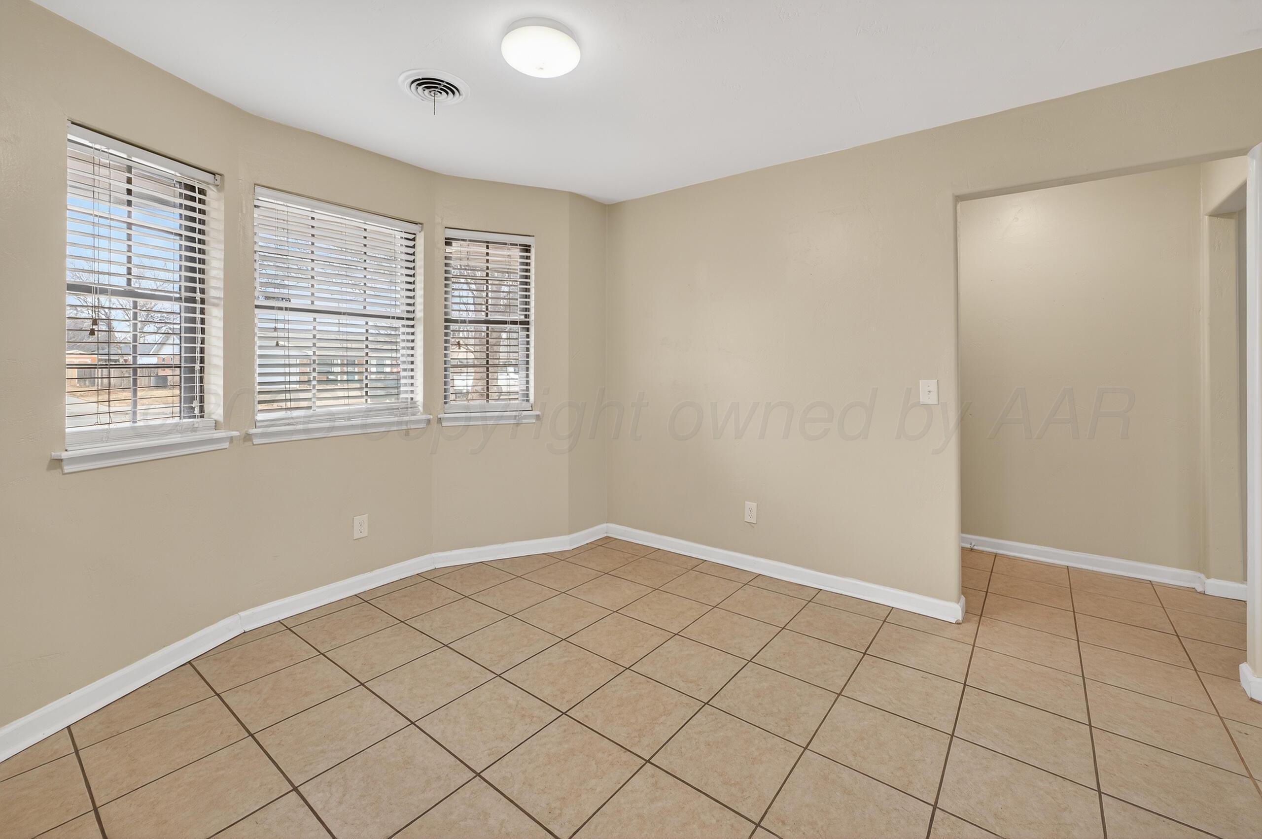 7313 Holyoke Trail Amarillo, TX 79121 - Photo 20 of 56 a view of an empty room with window