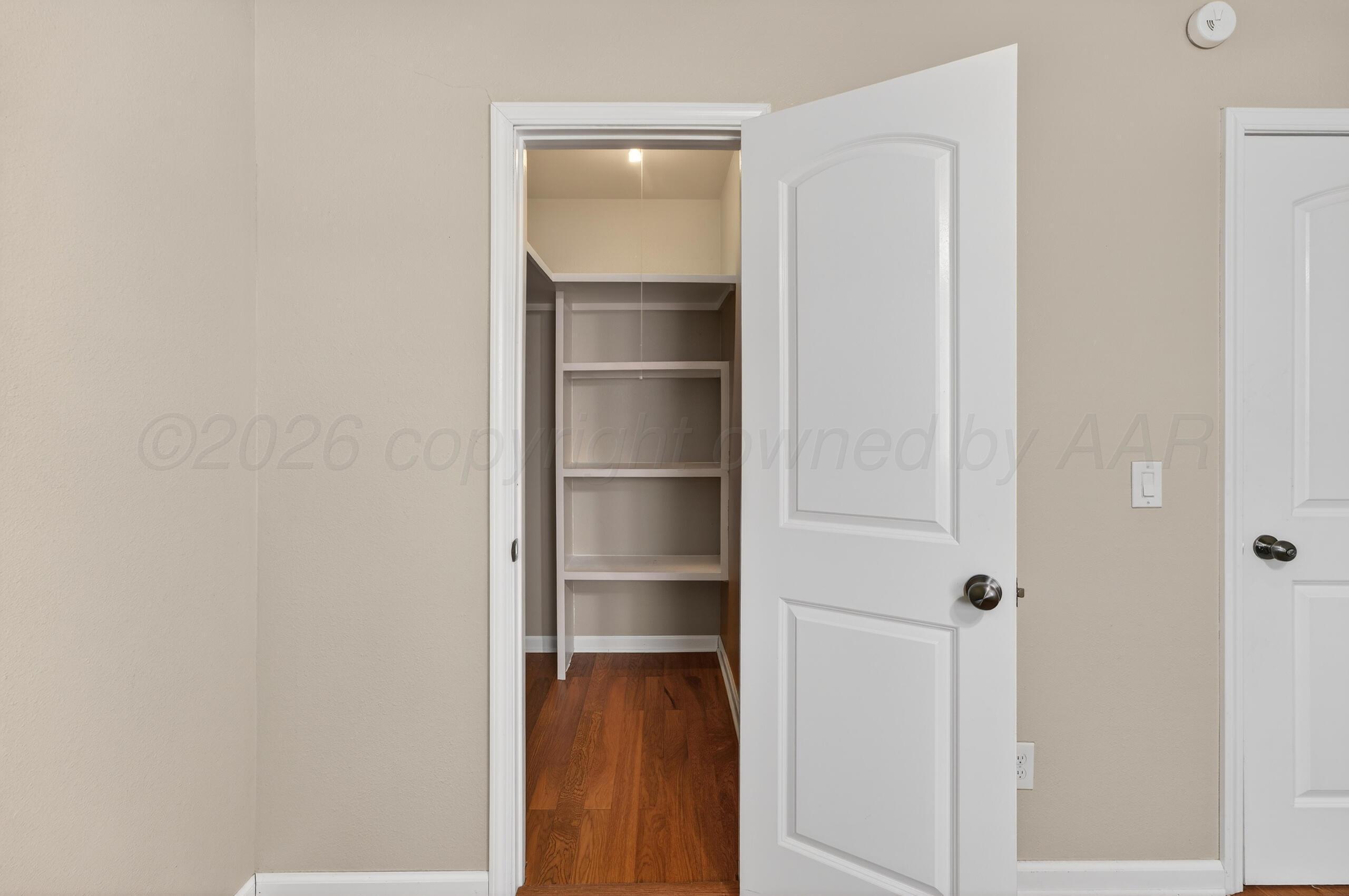 7313 Holyoke Trail Amarillo, TX 79121 - Photo 42 of 56 a view of a walk in closet with empty racks