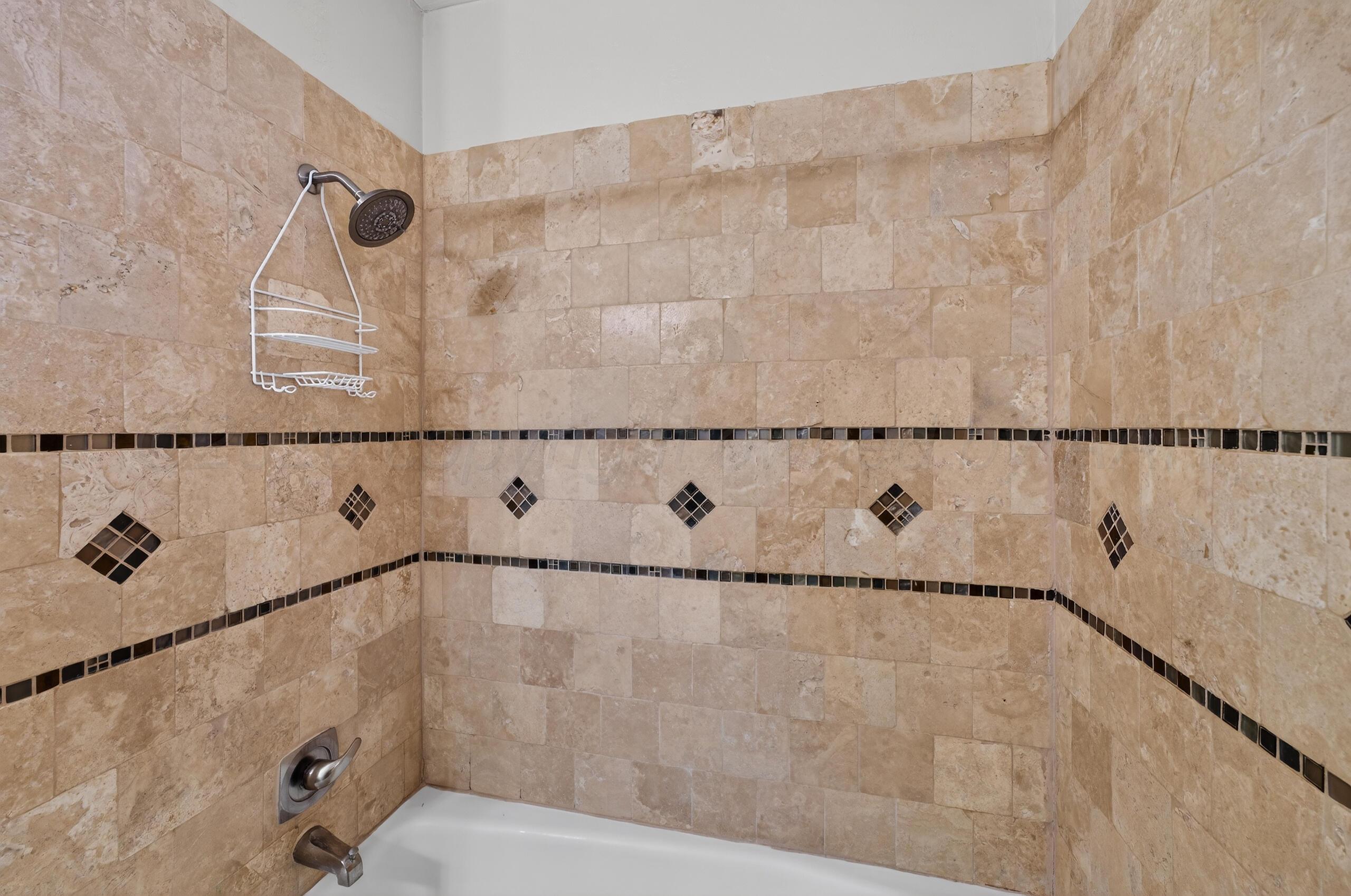 7313 Holyoke Trail Amarillo, TX 79121 - Photo 45 of 56 a bathroom with a bathtub and shower