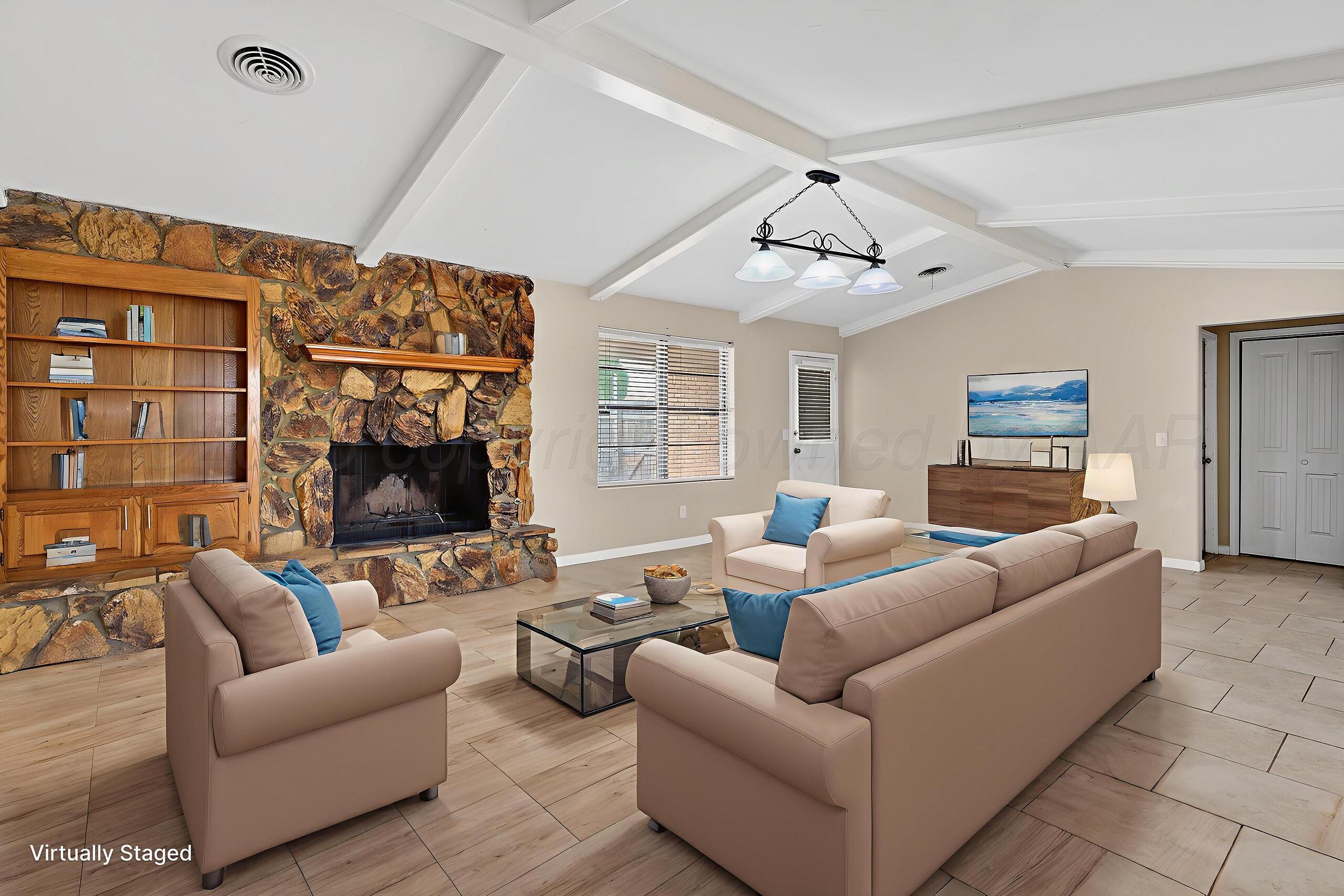 7313 Holyoke Trail Amarillo, TX 79121 - Photo 5 of 56 a living room with furniture and a fireplace