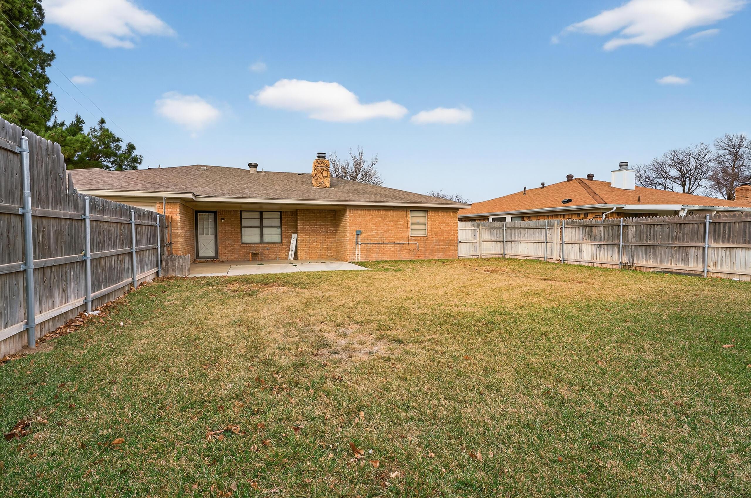 7313 Holyoke Trail Amarillo, TX 79121 - Photo 55 of 56 a view of a house with a garden and yard