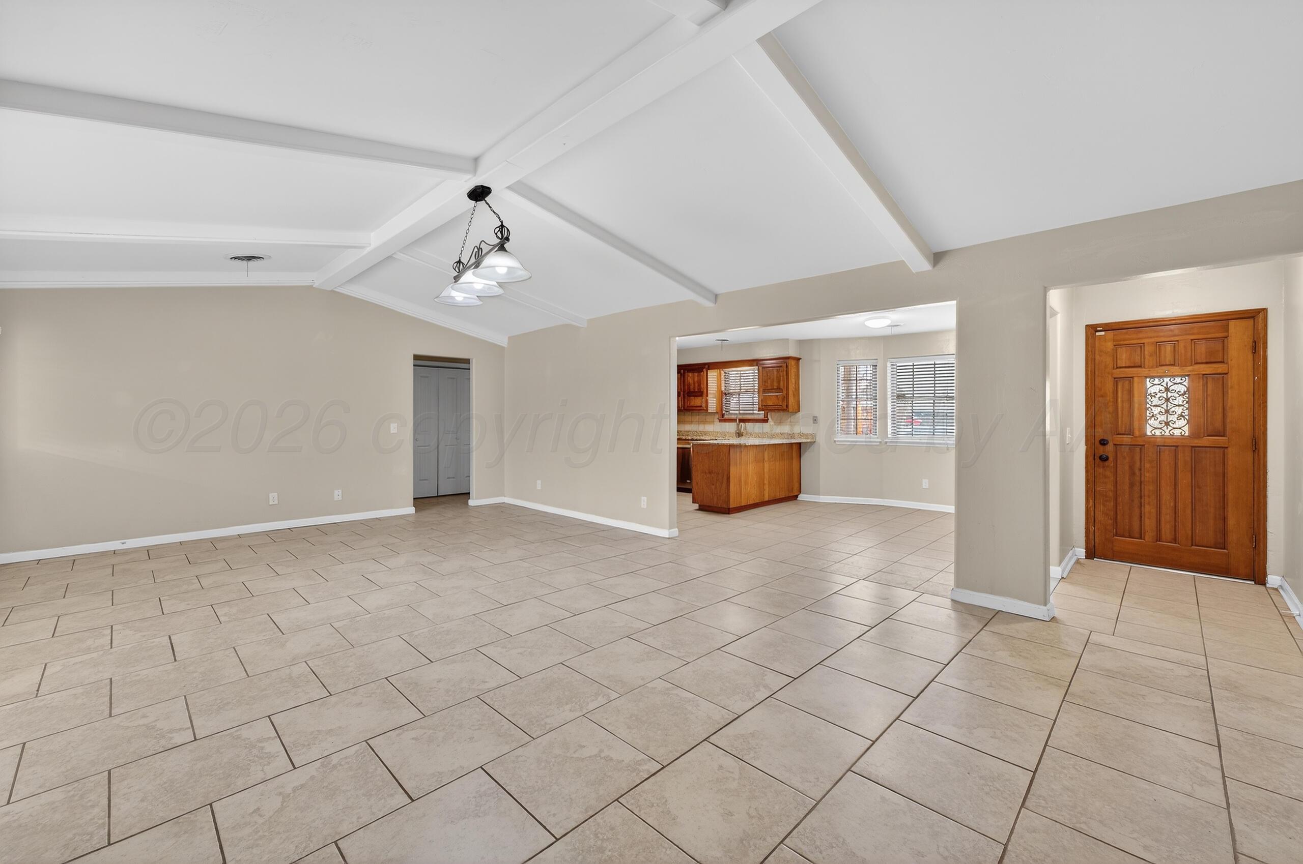 7313 Holyoke Trail Amarillo, TX 79121 - Photo 7 of 56 a view of empty room with windows