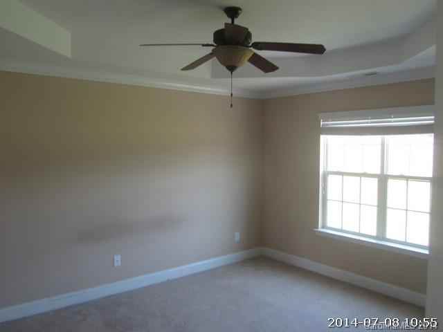 2904 Ruben Road, Unit 3 Monroe, NC 28112 - Photo 8 of 9 an empty room with a window and a fan